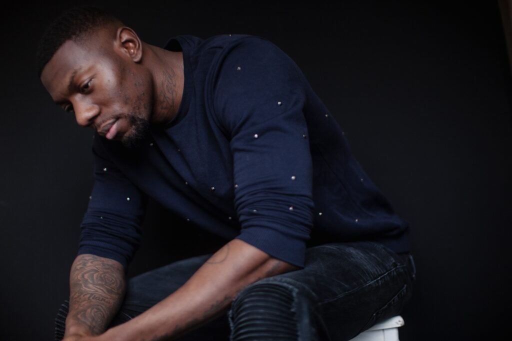 Sad dark skinned man thinking