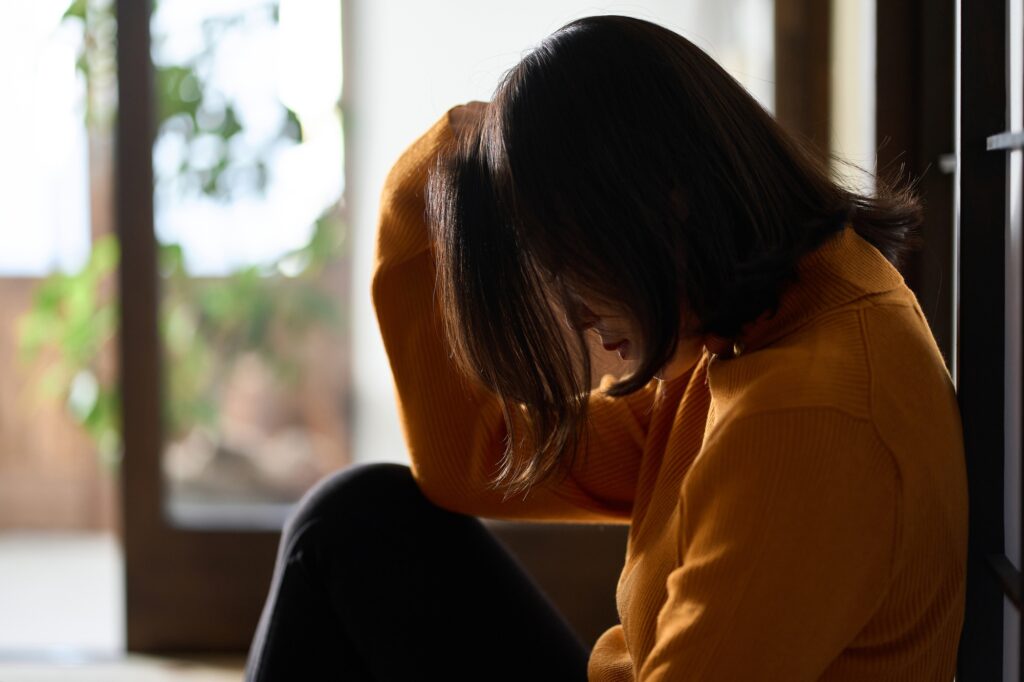 Anxious and depressed Asian woman