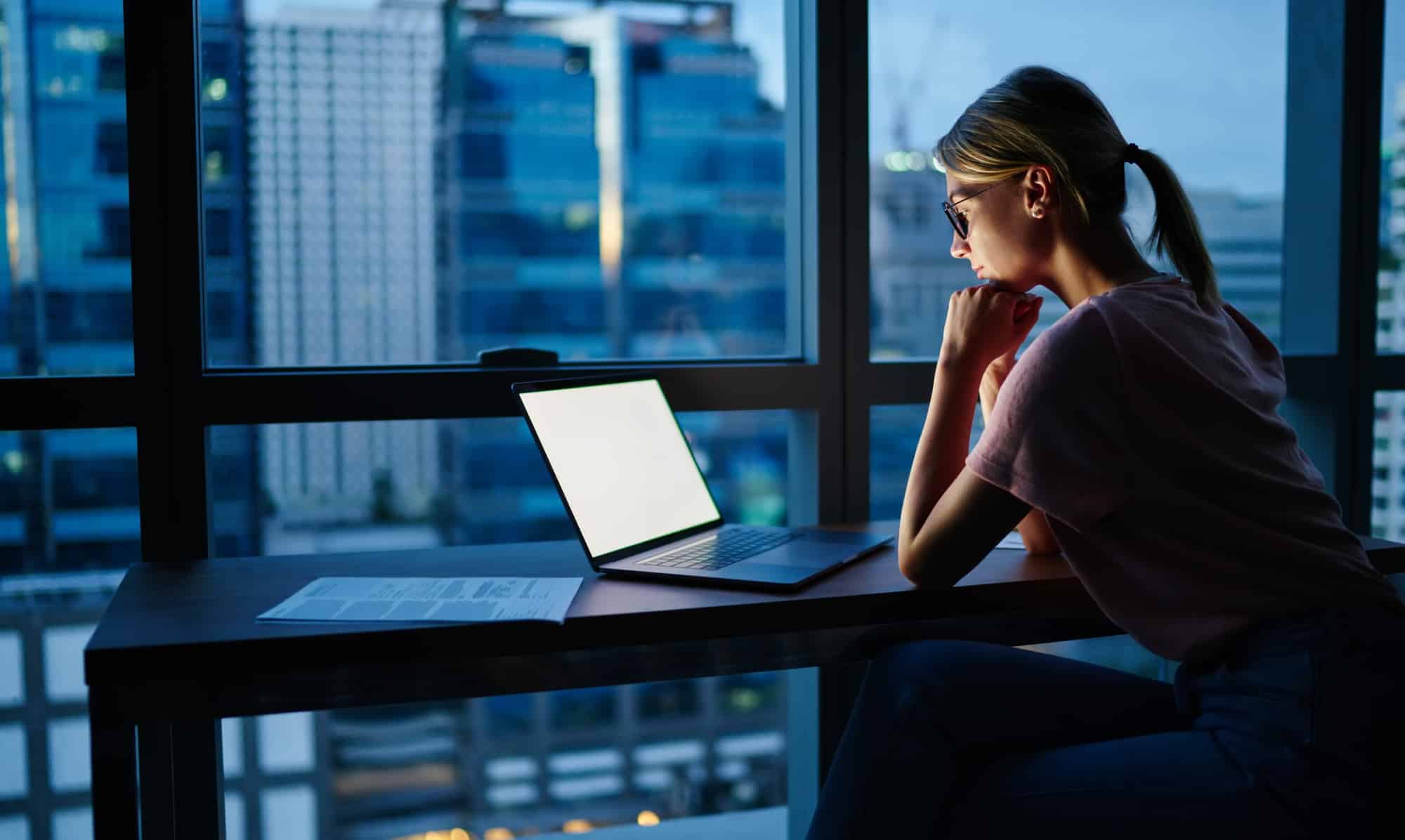 Woman working on business project in evening